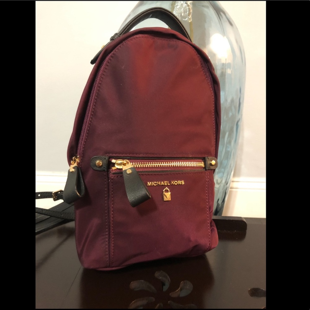 Maroon Michael Kors crossbody bag